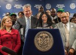 Local 372 School Crossing Guard Maria DeLaura speaks at a news conference at union headquarters on Jan.6. She is flanked by NYC Mayor Bill DeBlasio (left) and DC 37 Executive Director Henry Garrido (right).