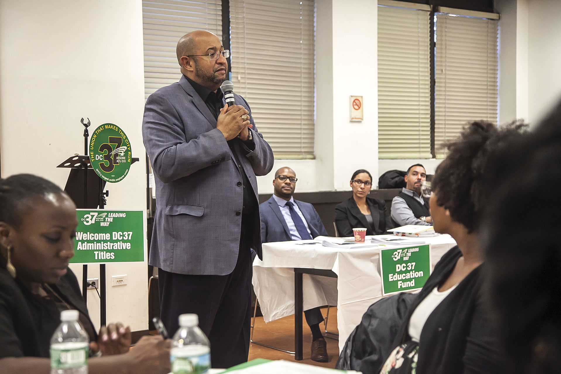 DC 37 Executive Director Henry Garrido speaks about the value of unionism at a town hall meeting on Oct. 24 for former mid-level managers who are now eligible to join the union because of a title reclassification. Photo: Clarence Elie-Rivera.