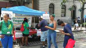 During Harlem Week, DC 37 activists gathered petition signatures to press Gov. Andrew Cuomo to sign the Enhanced Safety Net Hospital bill.