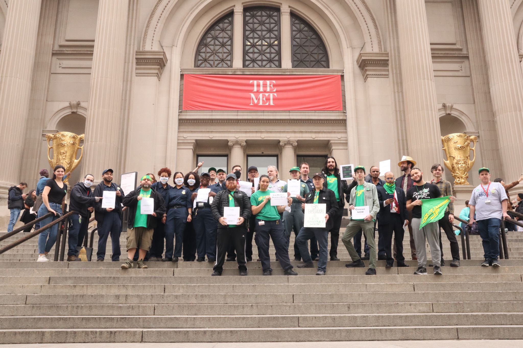 Met employees gather on the steps in front of the museum in December 2023 to call for a fair contract with the City of New York. Photo by Gabriel Papa