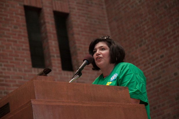 Costodial Assistant Roxana Galindez speaks at a forum at the Community Church of New York, where demonstrators went after they participated at a rally across the street from Gov. Andrew Cuomo's Manhattan office to demand fair funding for the City University of New York and new contracts for itrs employees. Photo by Mike Lee.