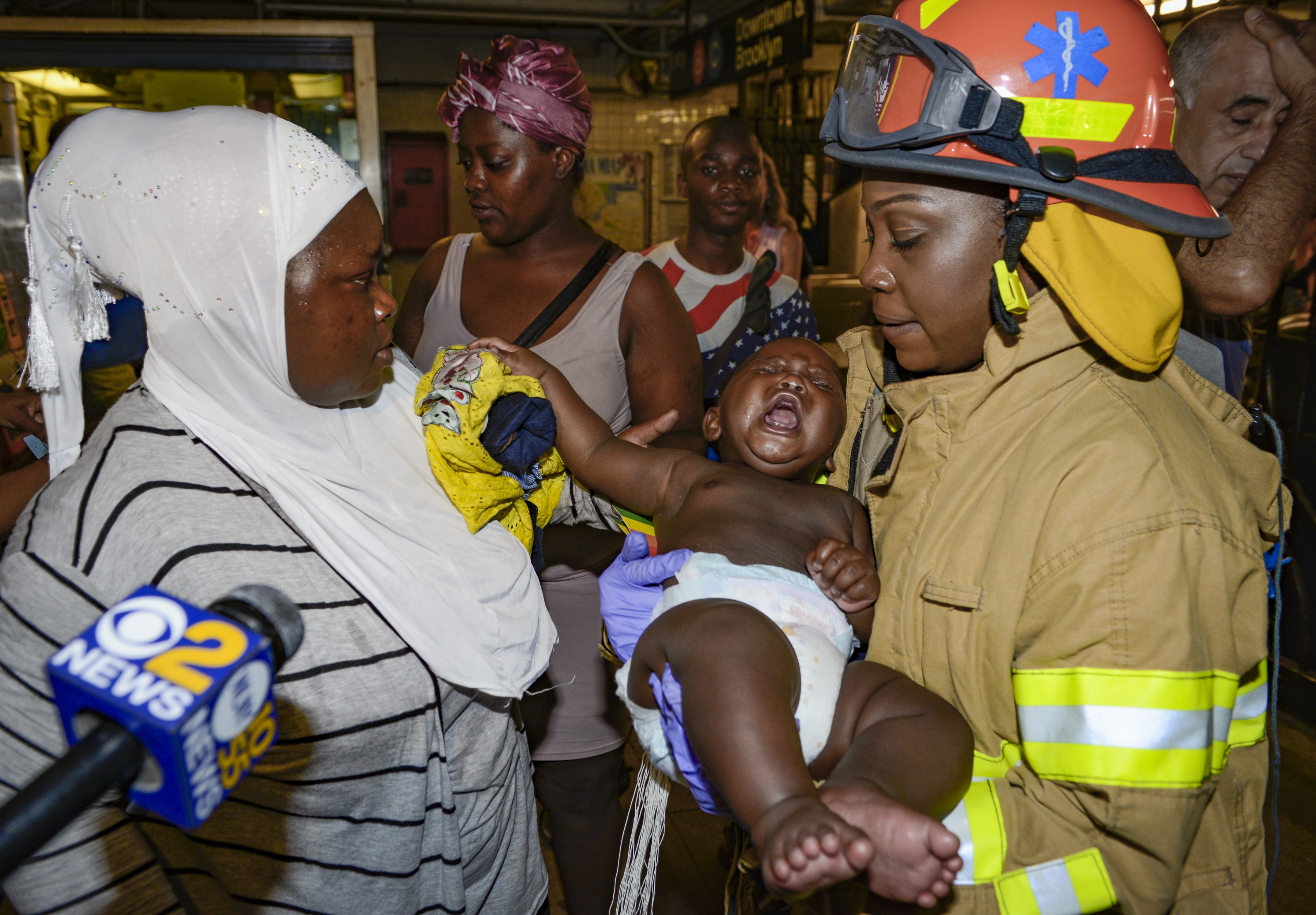 Emergency Medical Technicians Help Panic-Stricken Riders of Derailed Subway Train