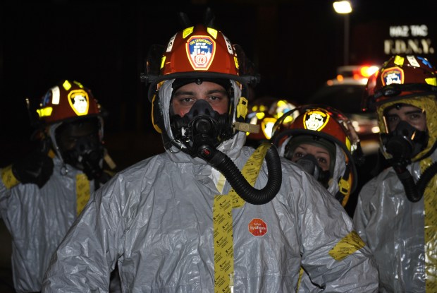 EMS crew wearing special protective gear rushed Ebola patient to Bellevue Hospital in October 2014. 