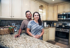 “We were in a bidding war with eight other buyers but because MEHP had our mortgage pre-approved, the owner sold the house to us,” said Local 376 member Ray Cabezas, Local 376, with wife, and Zoila. Photo Clarence Elie-Rivera