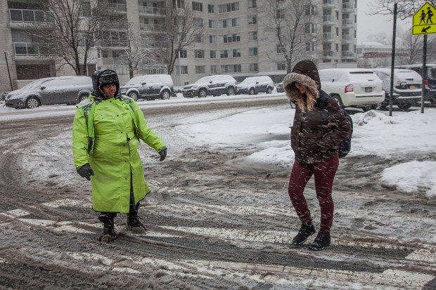 Juliet Waul_is one of the many School Crossing Guards who are ready to do their job rain or shine helping New Yorkers at dangerous intersections. Photo: Clarence Elie-Rivera