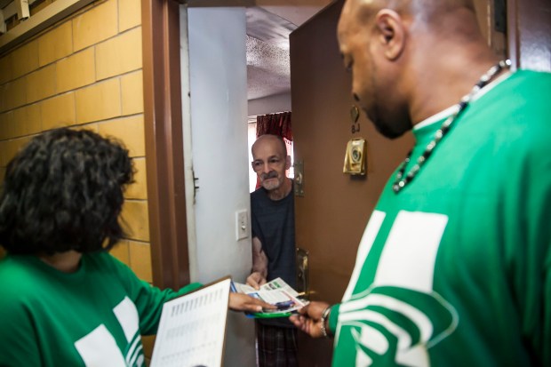 DC 37 activists went door-to-door in support of Hillary Clinton in the New York Democratic primary Pictured is Adalberto Soto, a resident at the Alfred E. Smith Houses in Manhattan's Lower East Side. Photo: Clarence Elie-Rivera